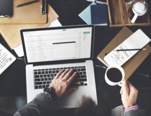 Man on laptop with coffee