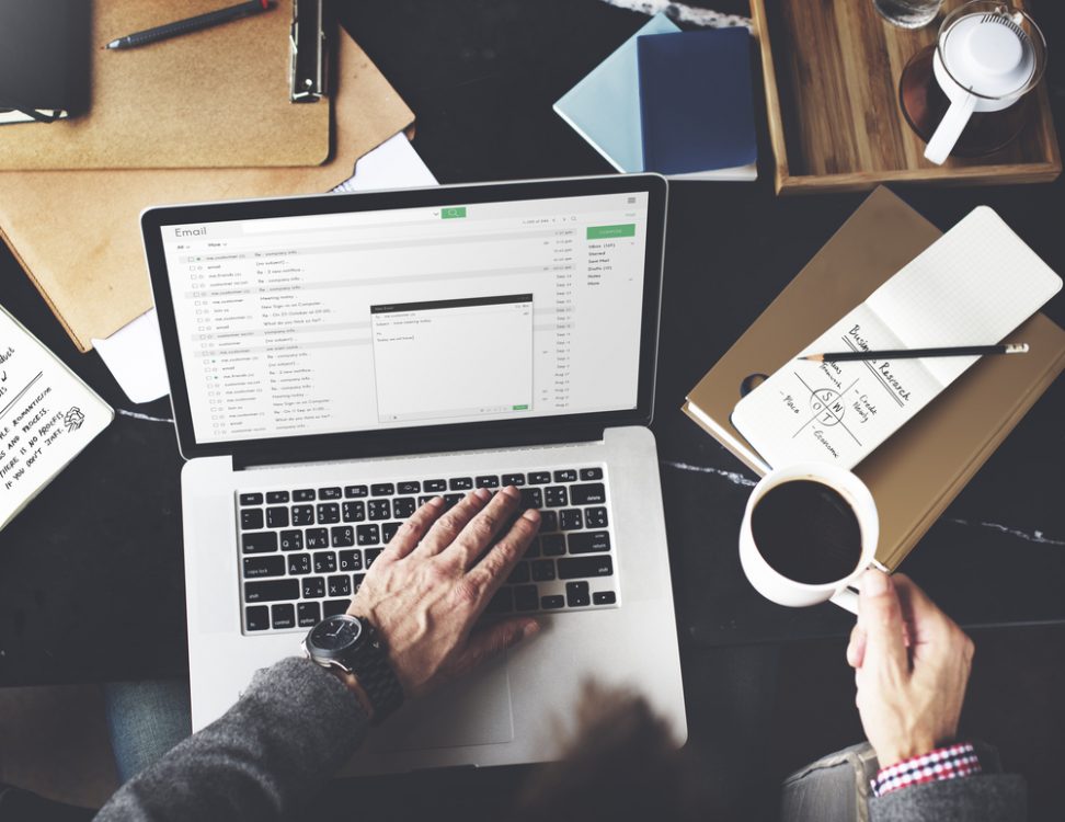Man on laptop with coffee