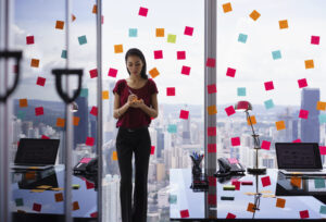 woman multi-tasking with sticky notes