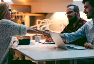 Female candidate shaking hands at a job interview