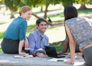 Colleagues working together in a park