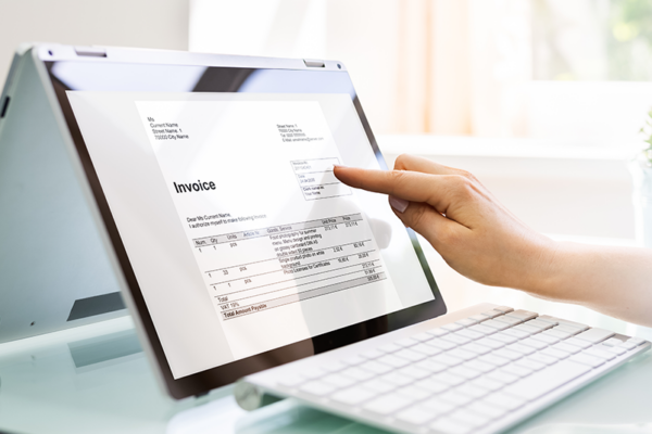 A laptop with invoice on the screen.