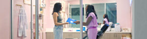 A business owner and her customer talking