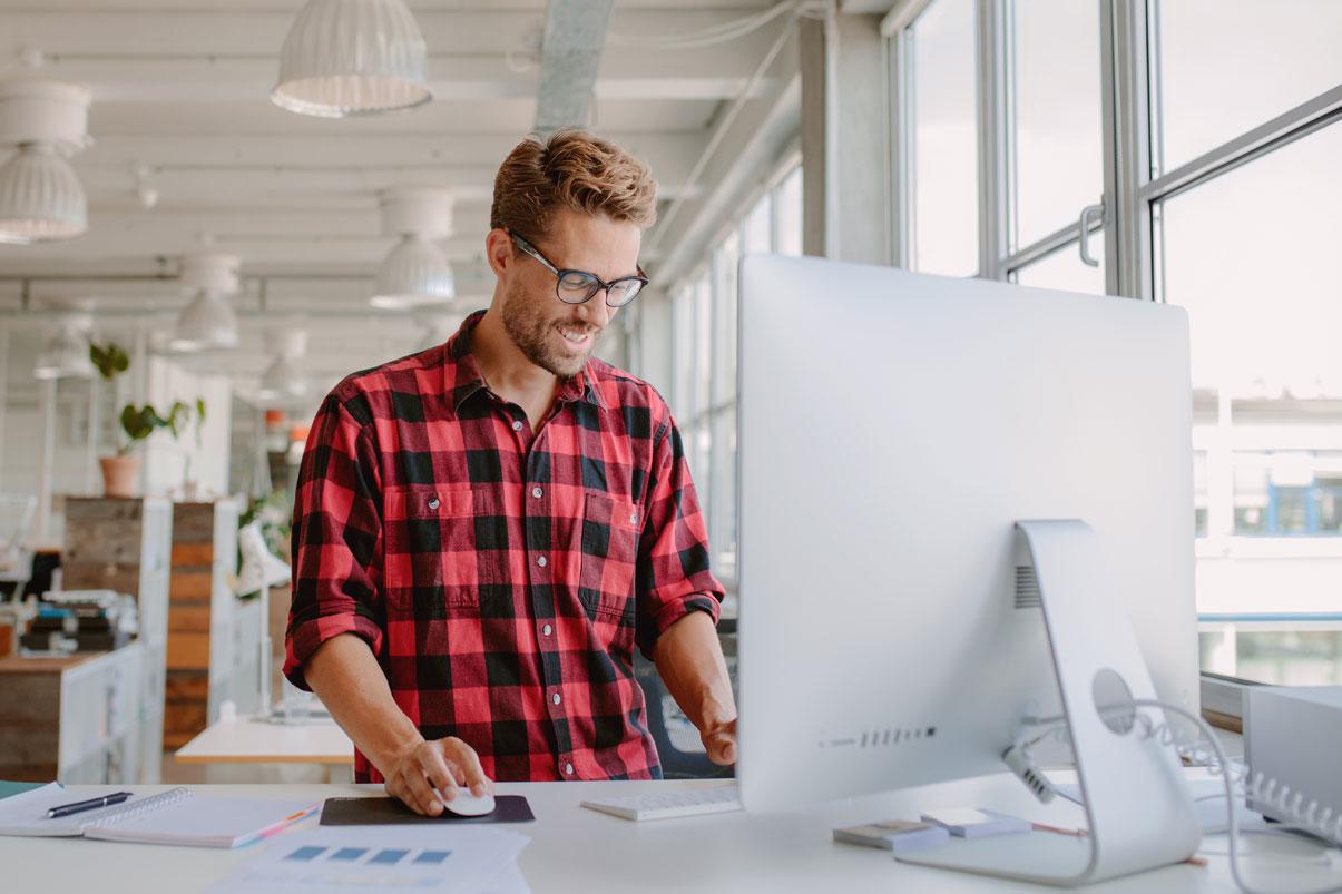 Man working at a standing desk