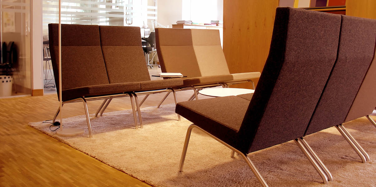 Stylish guest chairs in modern waiting room