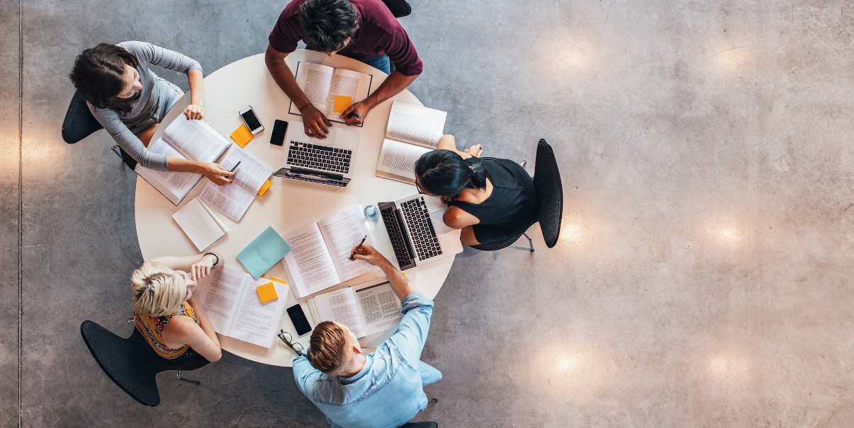 Coworkers collaborating around a table