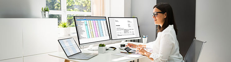 Image of a woman sitting at a desk