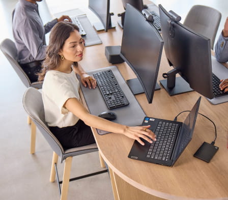 Image of a woman sitting at a desk