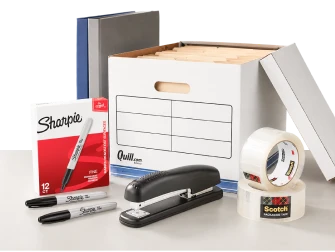 Assorted office supplies including markers, binders, stapler, and tape