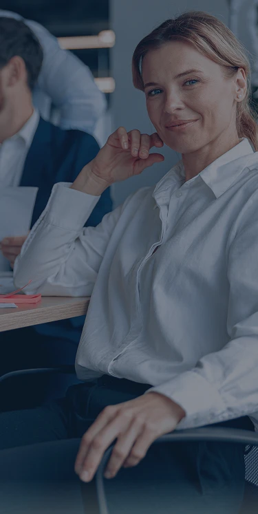 a person smiling holiding a quill.com box