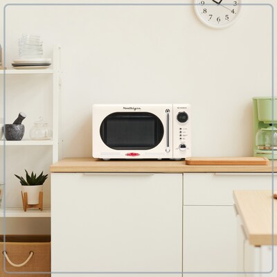 Nostalgia Retro 0.7 Cubic Foot Countertop Microwave, Ivory (NRMO7IVY6A)